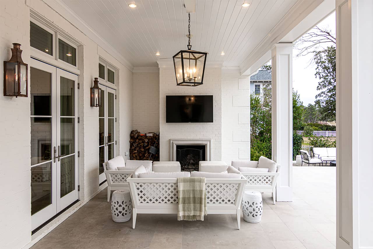 The back porch of a Georgian style custom built luxury home located in midtown Wilmington North Carolina